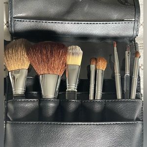 Brand set of Clinique brushes with brush belt.